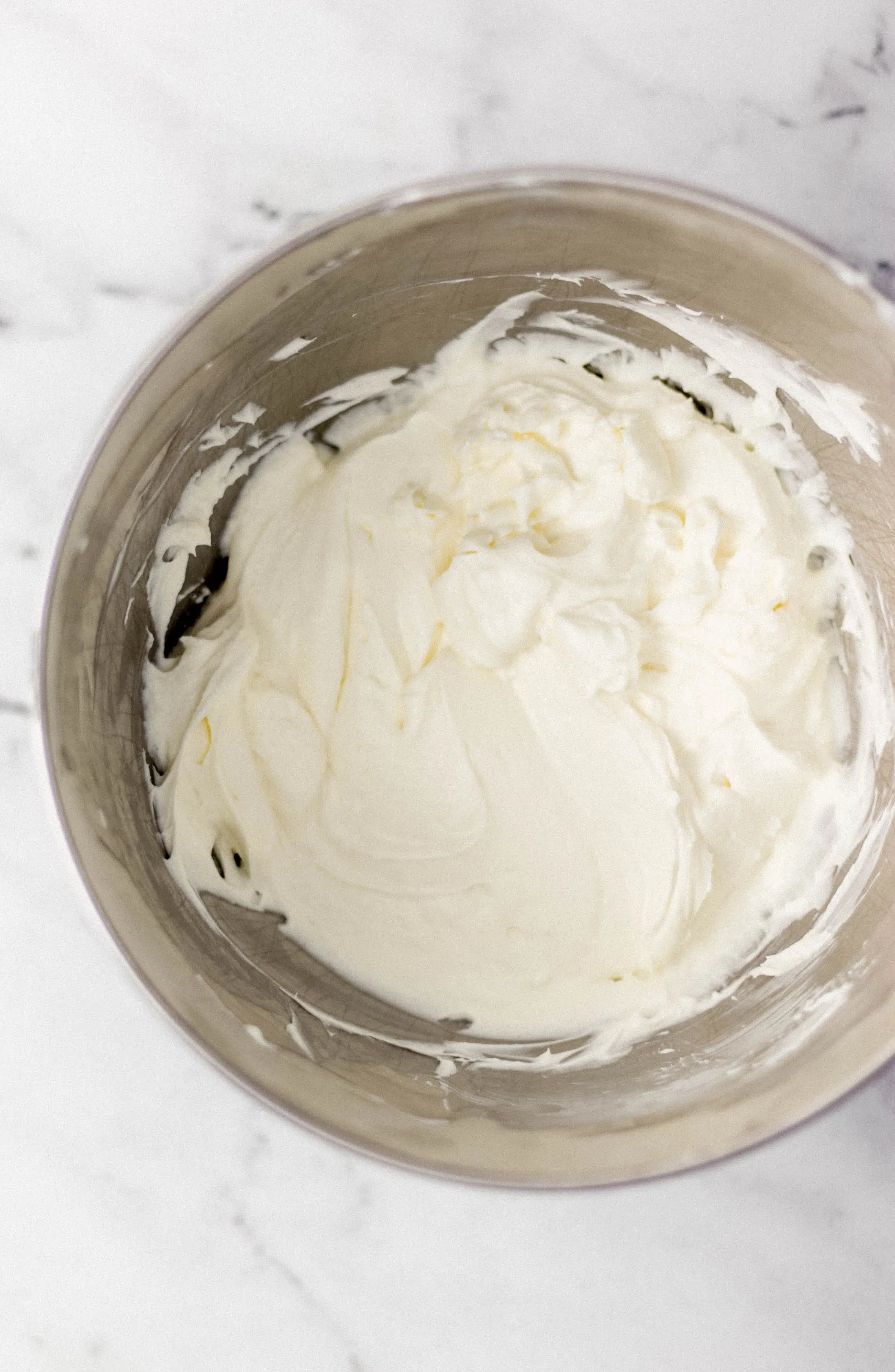 cream mixture for trifle in mixing bowl
