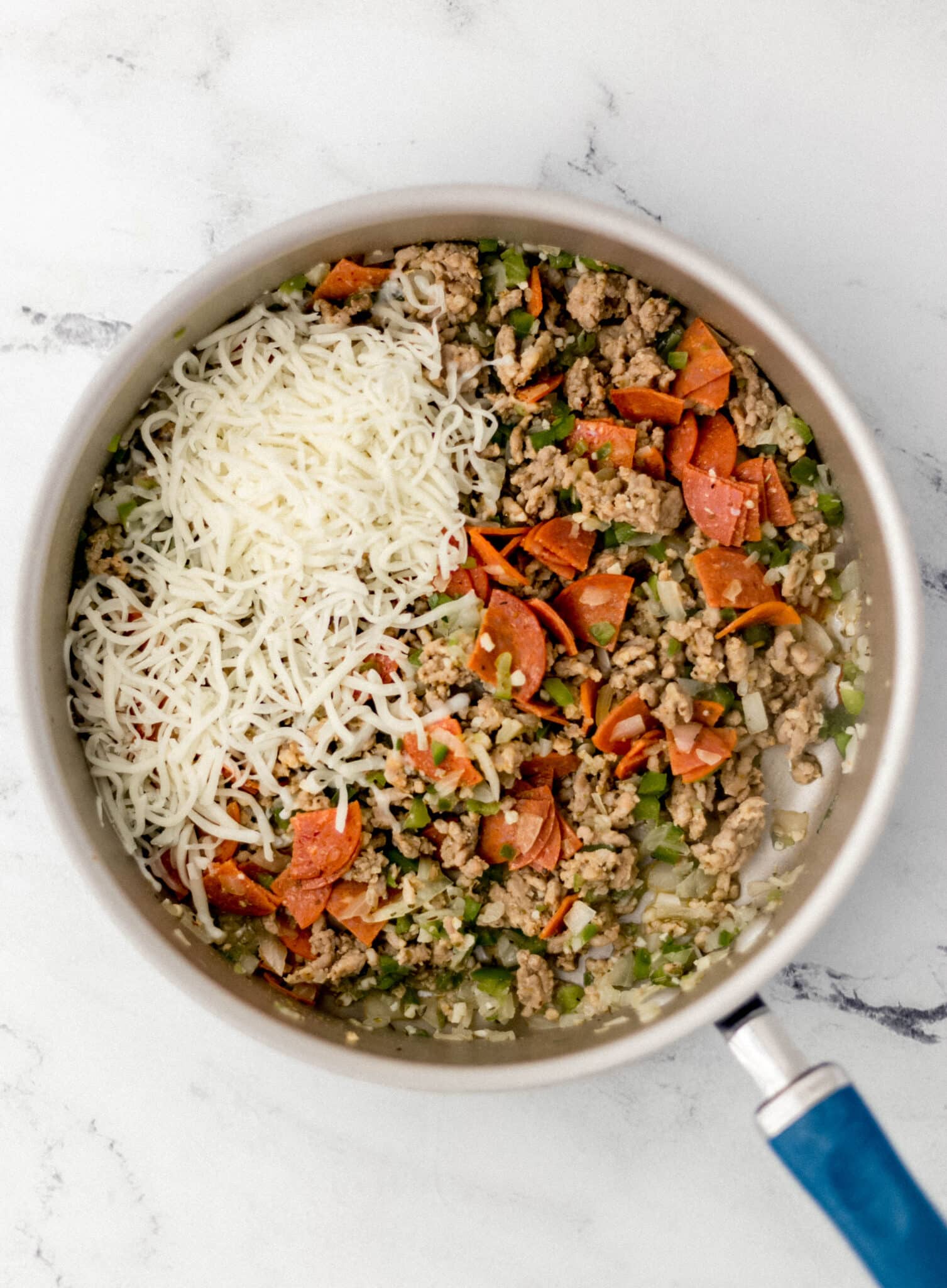 skillet with stuffing mixture for pasta shells