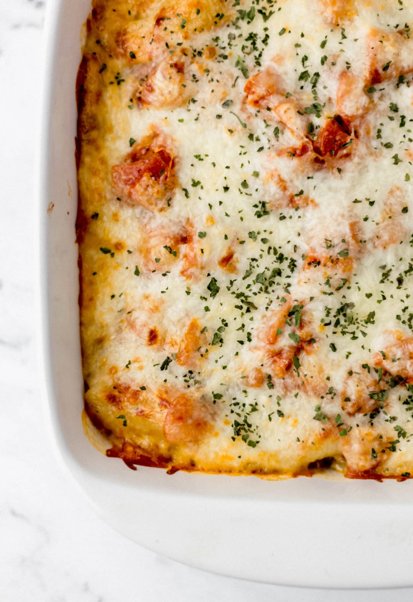 overhead view of finished pasta in square white baking dish