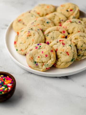 white plate with funfetti sugar cookies on it