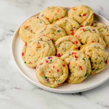 large white plate with sugar cookies on it