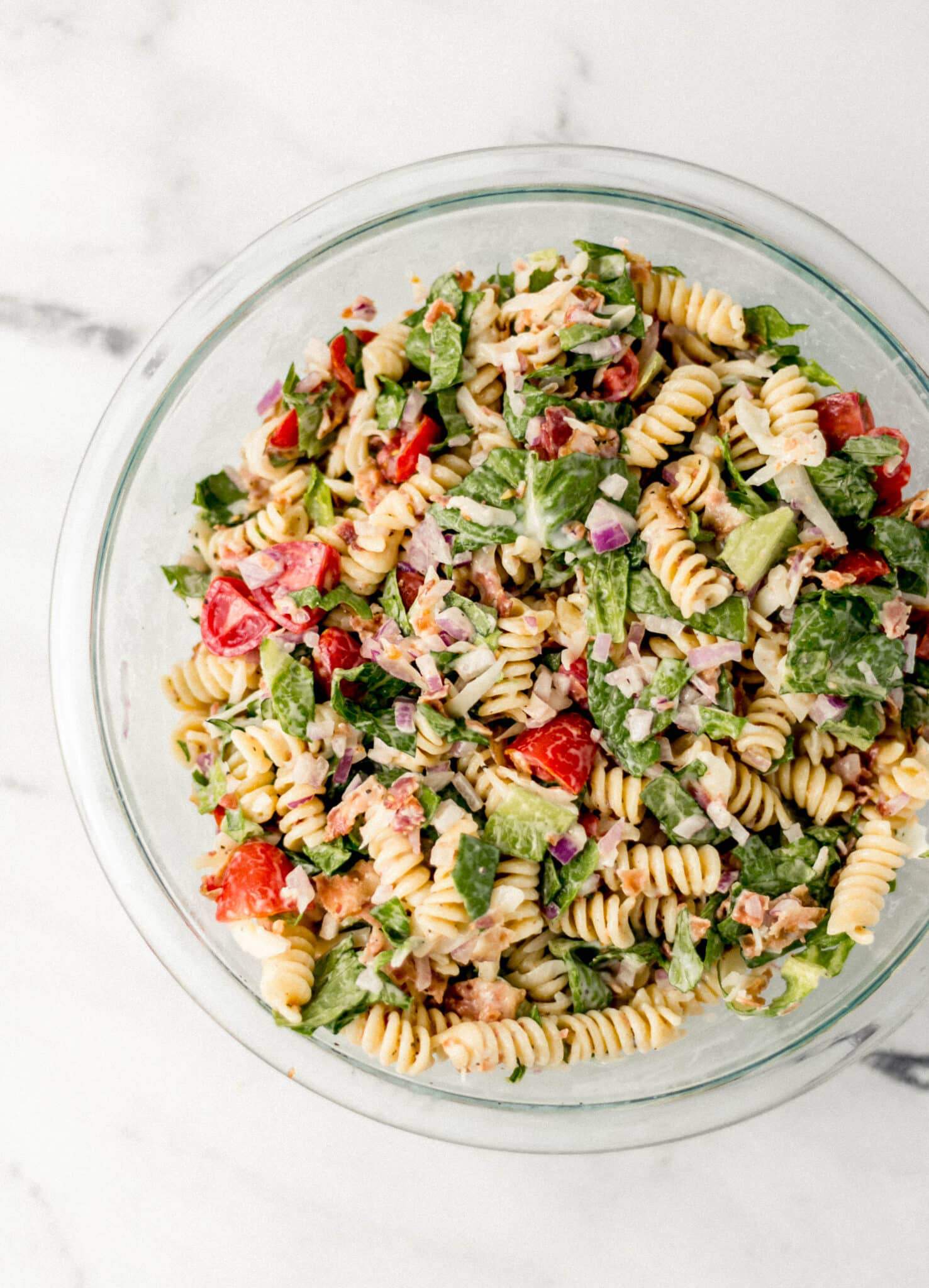 pasta salad in large glass bowl 