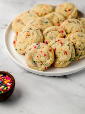 white plate with funfetti sugar cookies on it