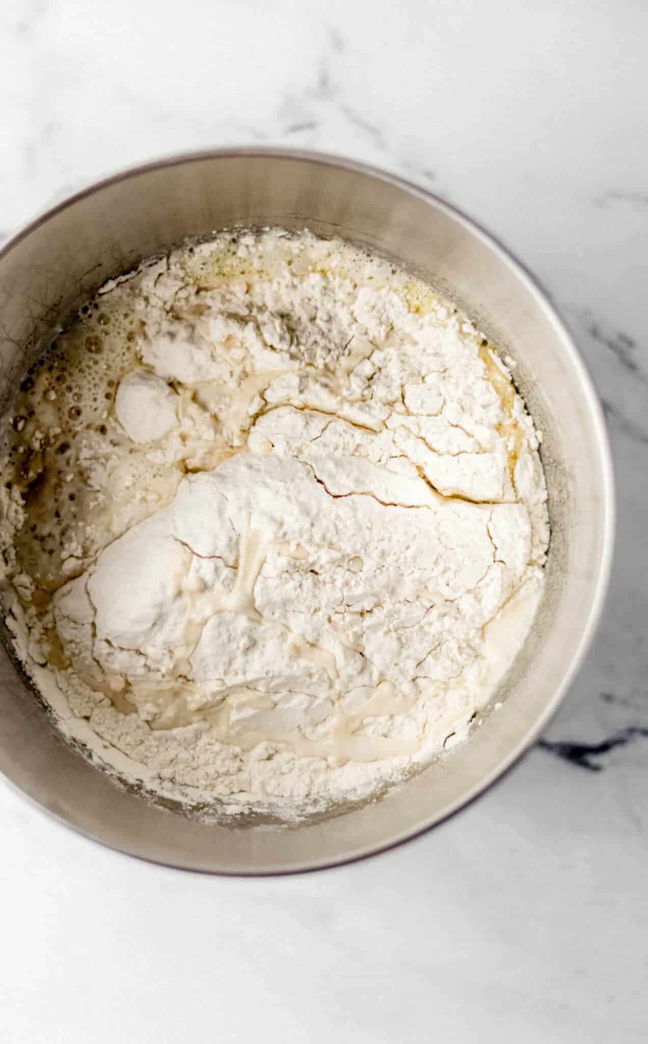 ingredients to make rolls combined in mixing bowl