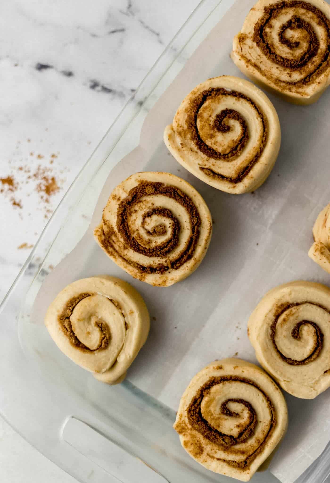 cut rolls in parchment lined glass baking dish before rising