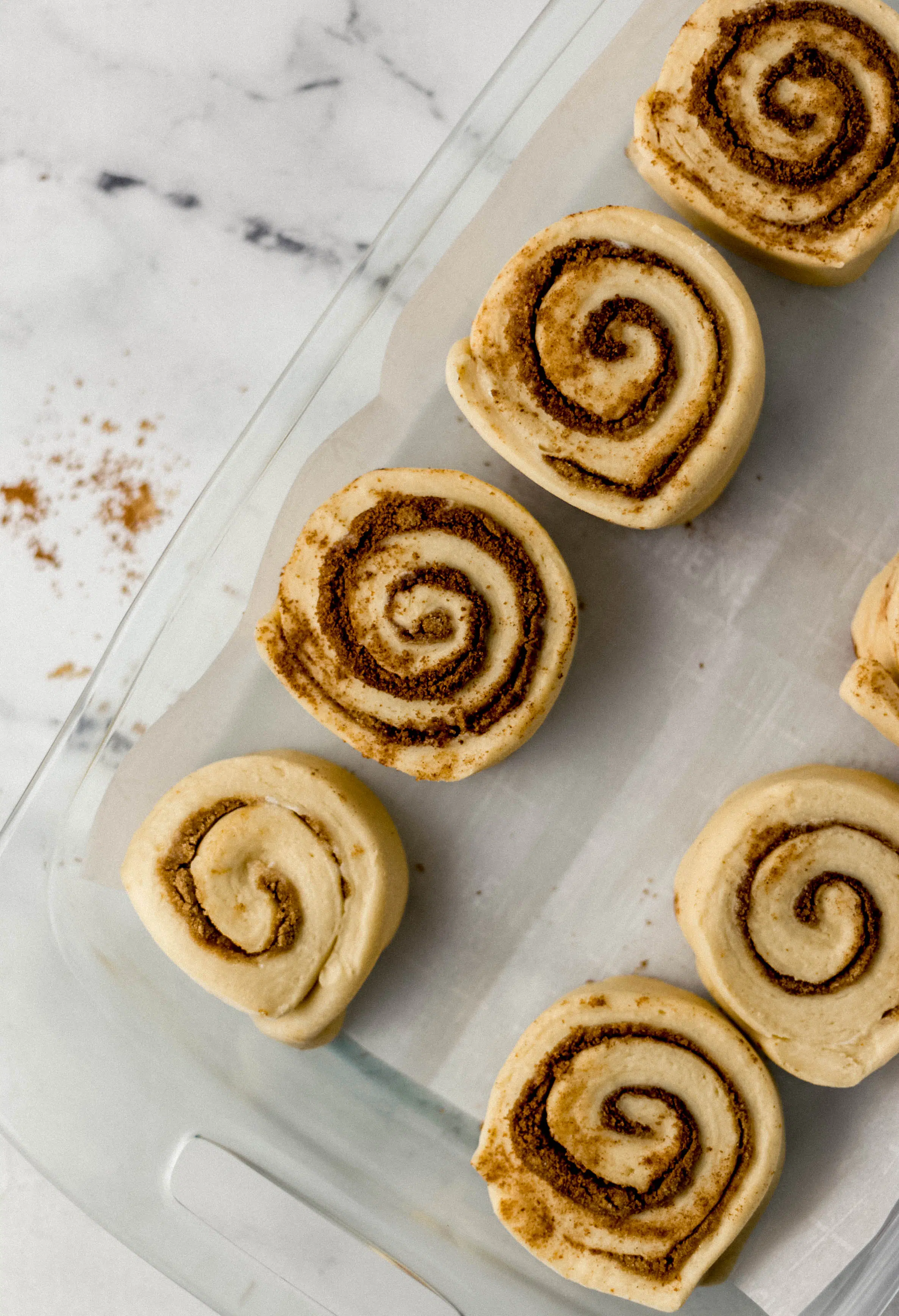 cut rolls in parchment lined glass baking dish before rising 
