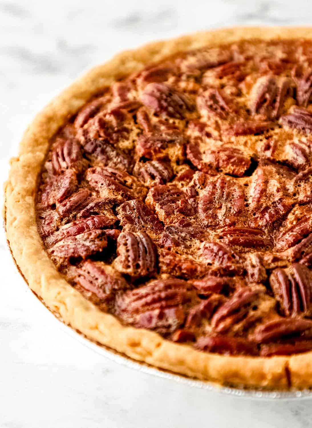 Close up front view of finished pie in pie tin.