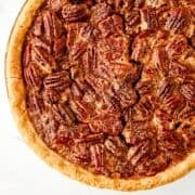 Close up view of baked whole pecan pie.