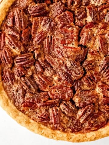 Close up view of baked whole pecan pie.