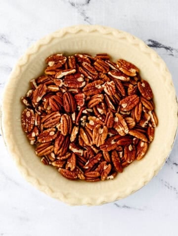 Pie crust with pecans added to it.