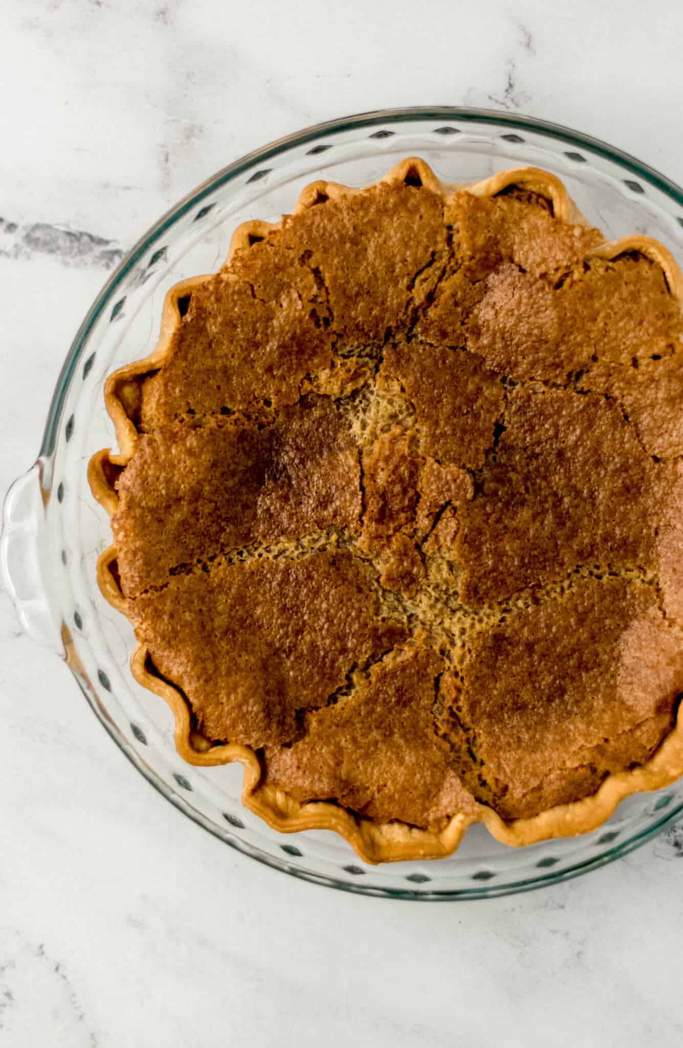 overhead view of finished brown sugar pie in glass dish
