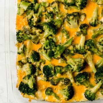 overhead view of baked chicken and broccoli casserole in rectangle glass baking dish