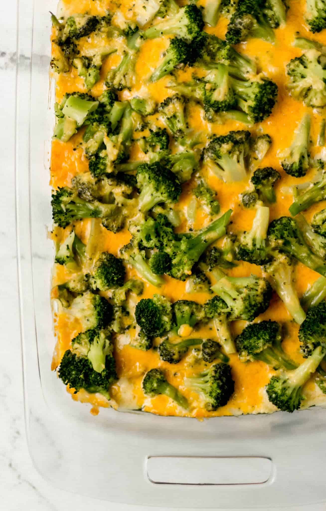 overhead view of finished chicken and broccoli casserole in glass baking dish 