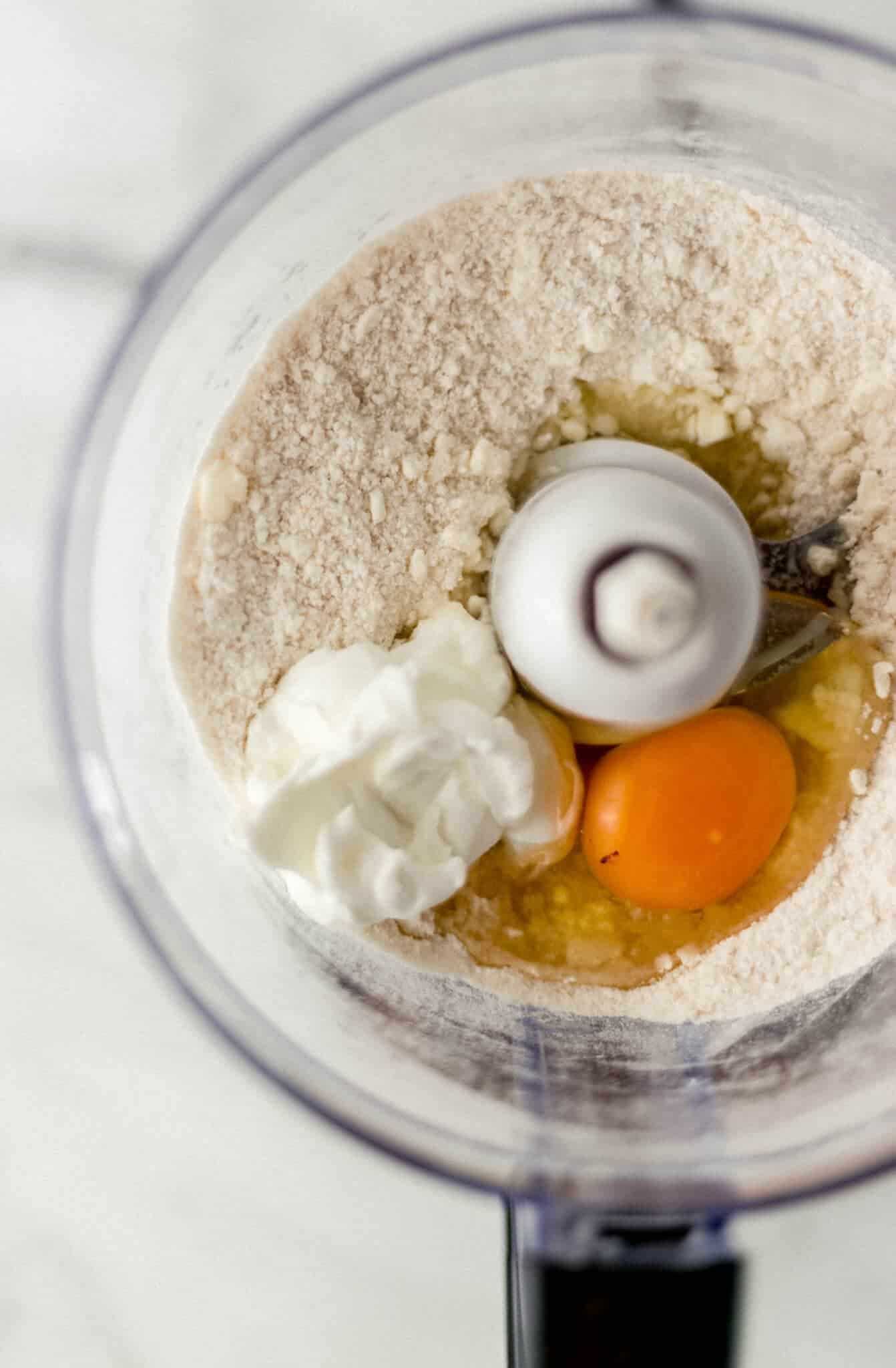 butter mixture, egg, and yogurt in food processor 