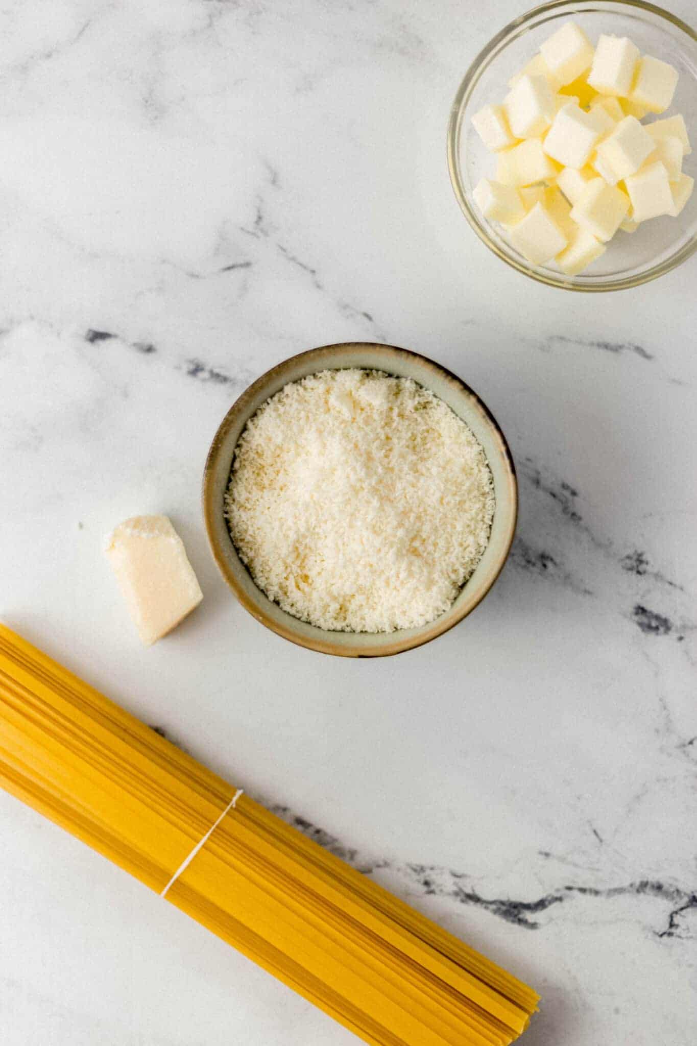 overhead view of ingredients needed to make alfredo pasta 