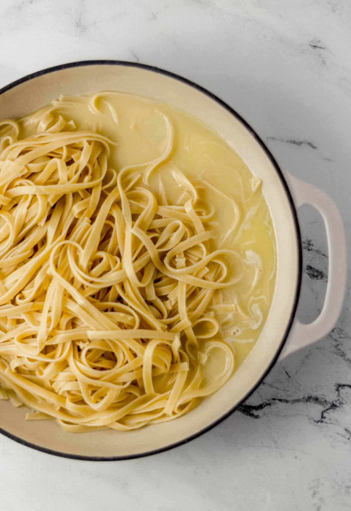 cooked pasta and sauce in skillet