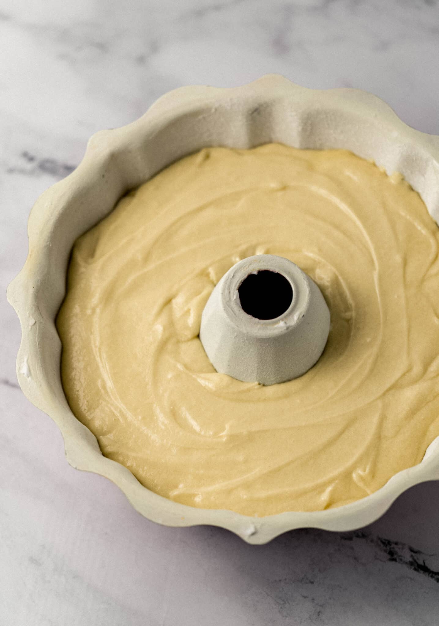 cake mixture poured into prepared bundt pan before baking