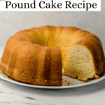 whole cake on plate with a slice cut out of it
