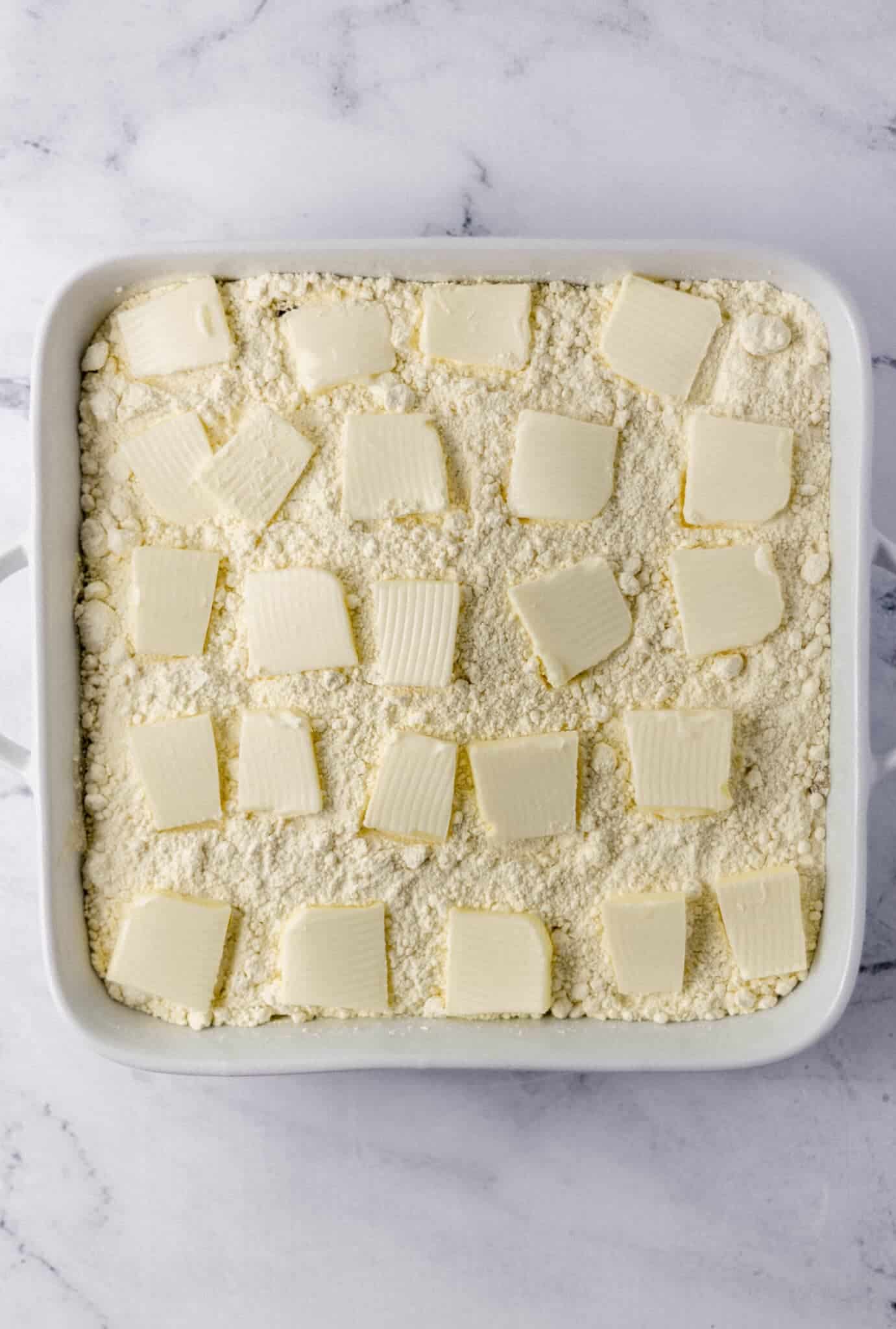 butter placed on top of cake mix 