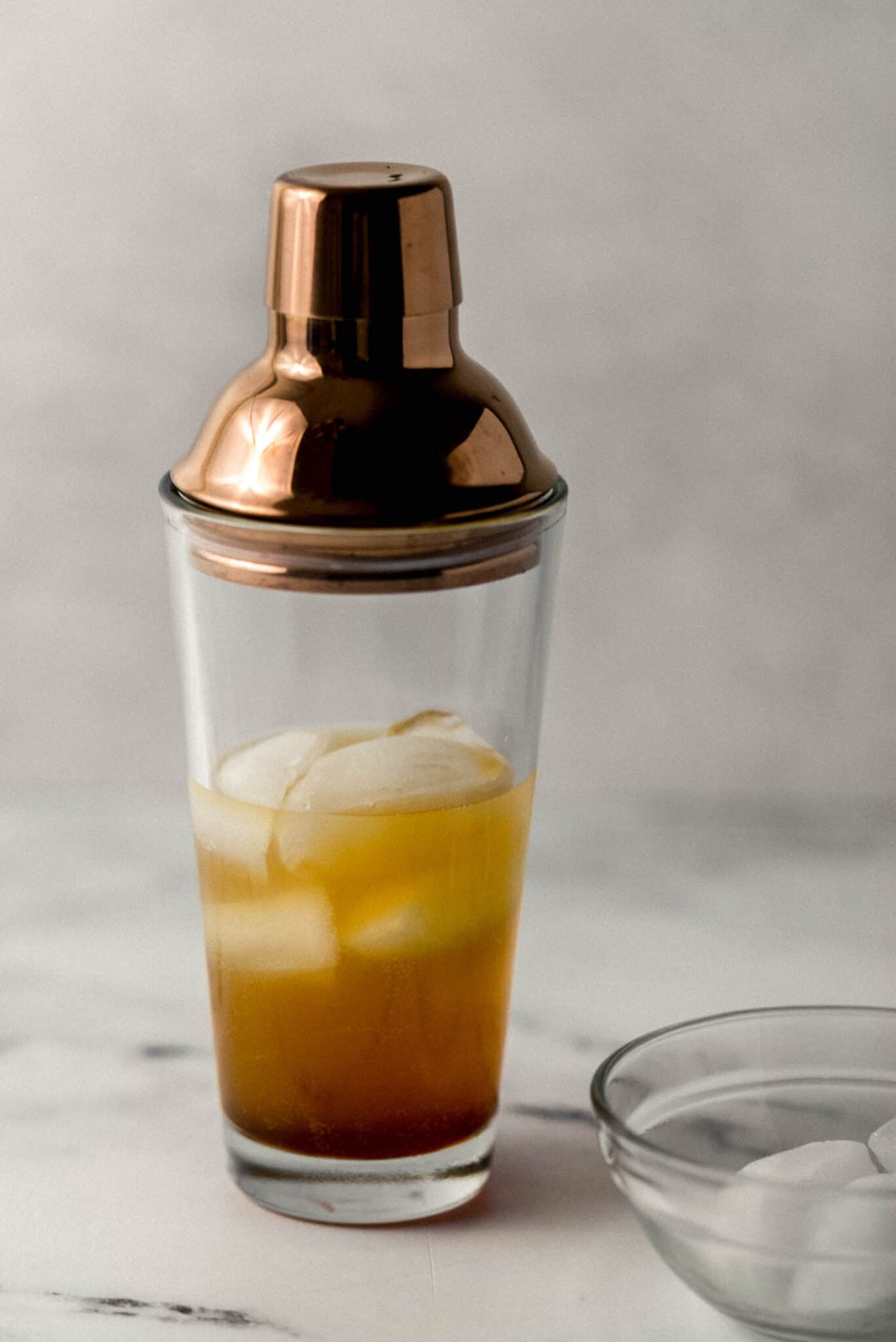 shaker with ingredients to make margarita in it
