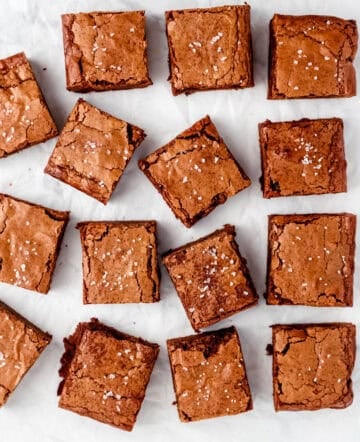 Overhead view of finished brownies on parchment paper.