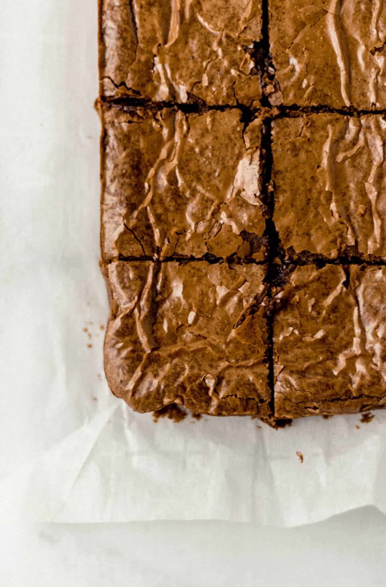 overhead view of finished fudgy brownies cut into small squares 