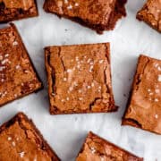 Overhead view of finished brownies on parchment paper.