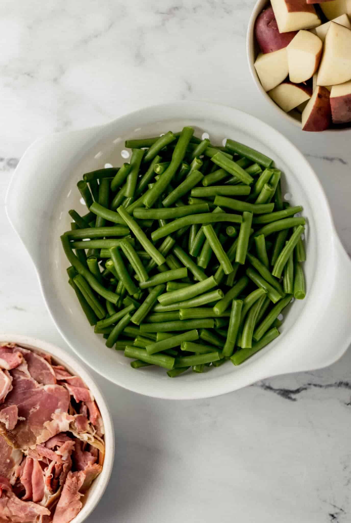 ingredients needed to make green beans with ham and potatoes
