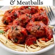 Close up view of plate of spaghetti on pin with text overlay.