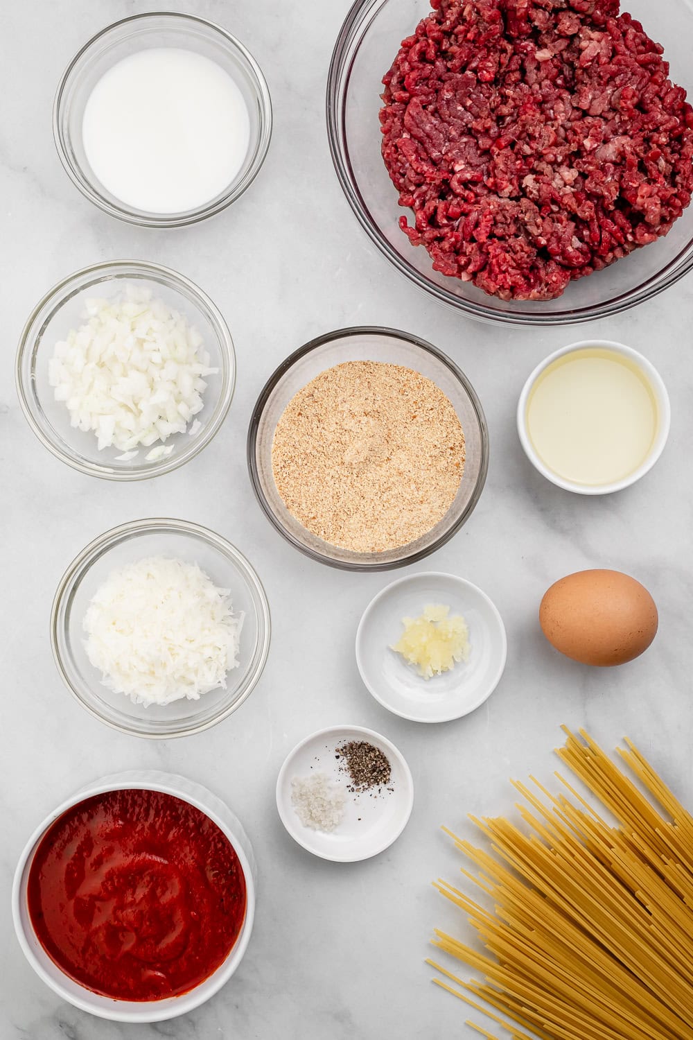Ingredients needed to make recipe in separate bowls.