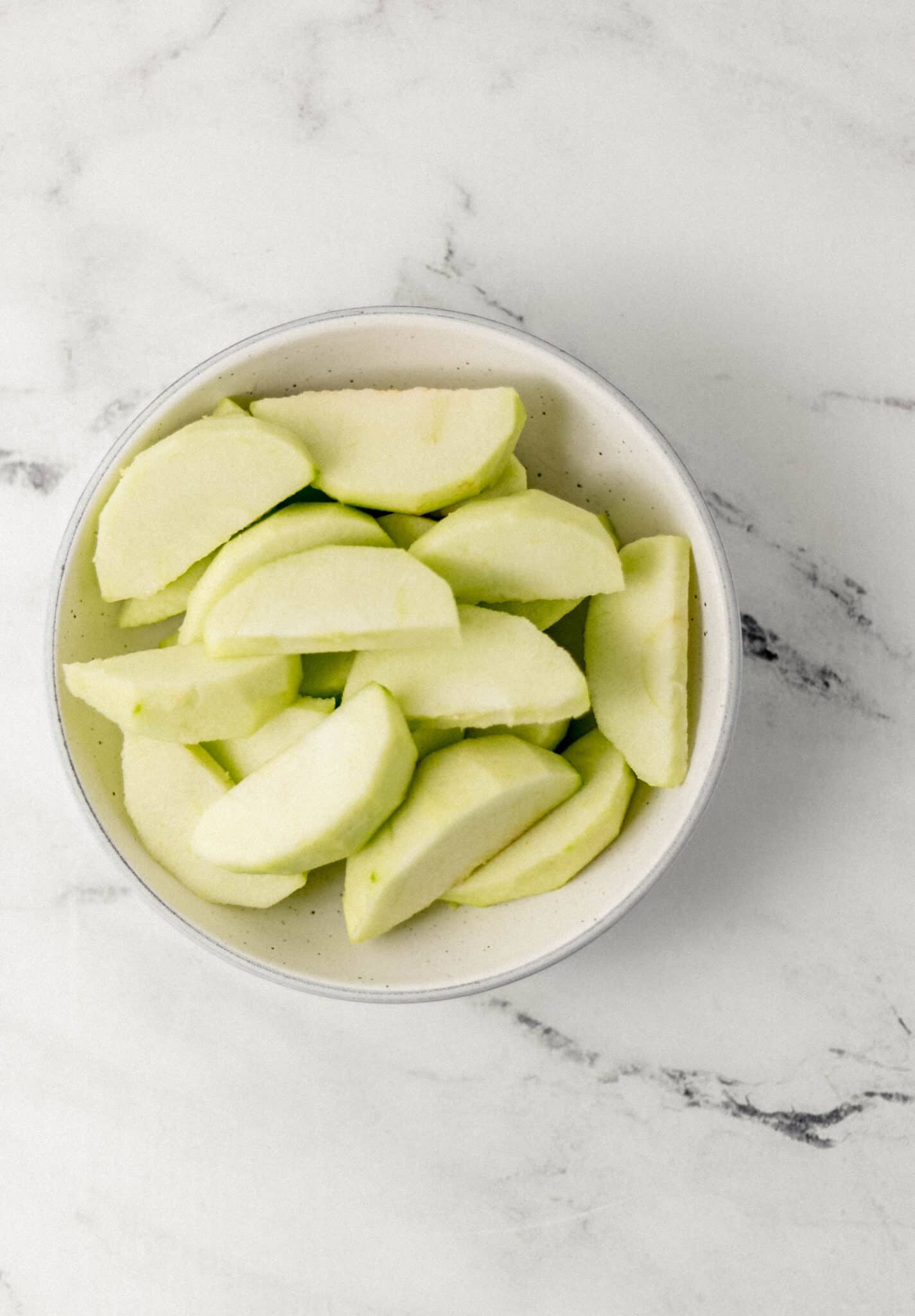 Apples for the Apple Dumplings apple slices in a bowl