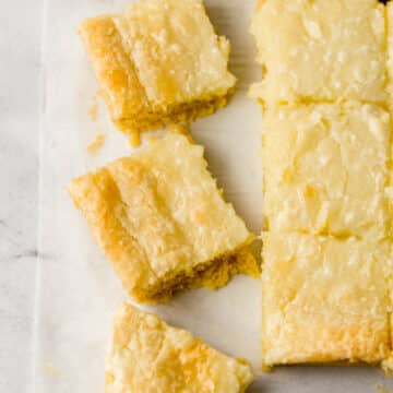 overhead view of cut chess squares on parchment paper