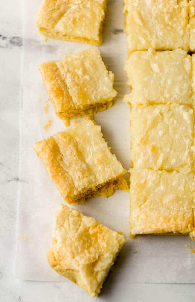 overhead view of cut chess squares on parchment paper