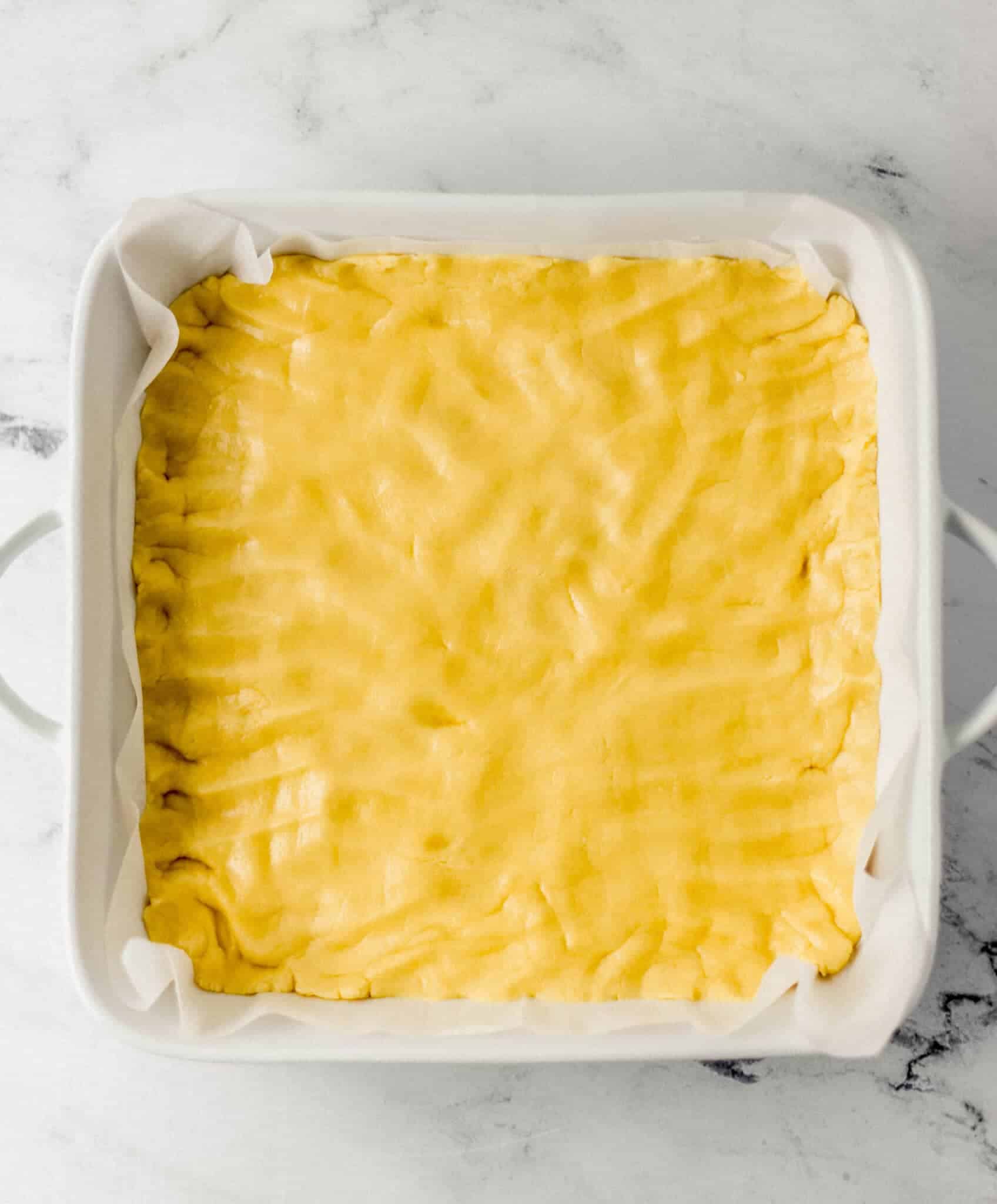 ingredients to make crust combined and pressed into the bottom of a baking dish