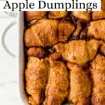 Close up view of apple dumplings in white baking dish on pin with text overlay.