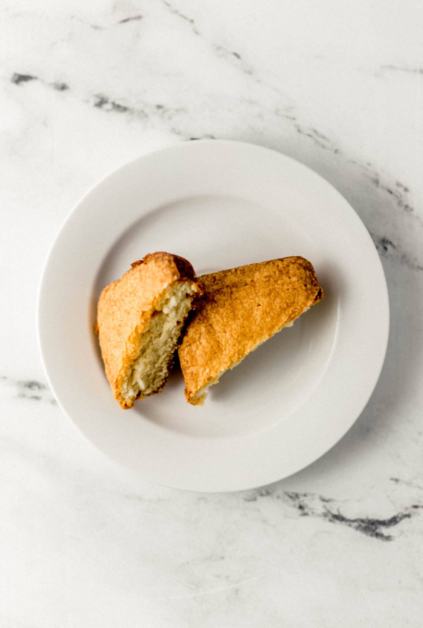 cut pieces of cake on small white plate 