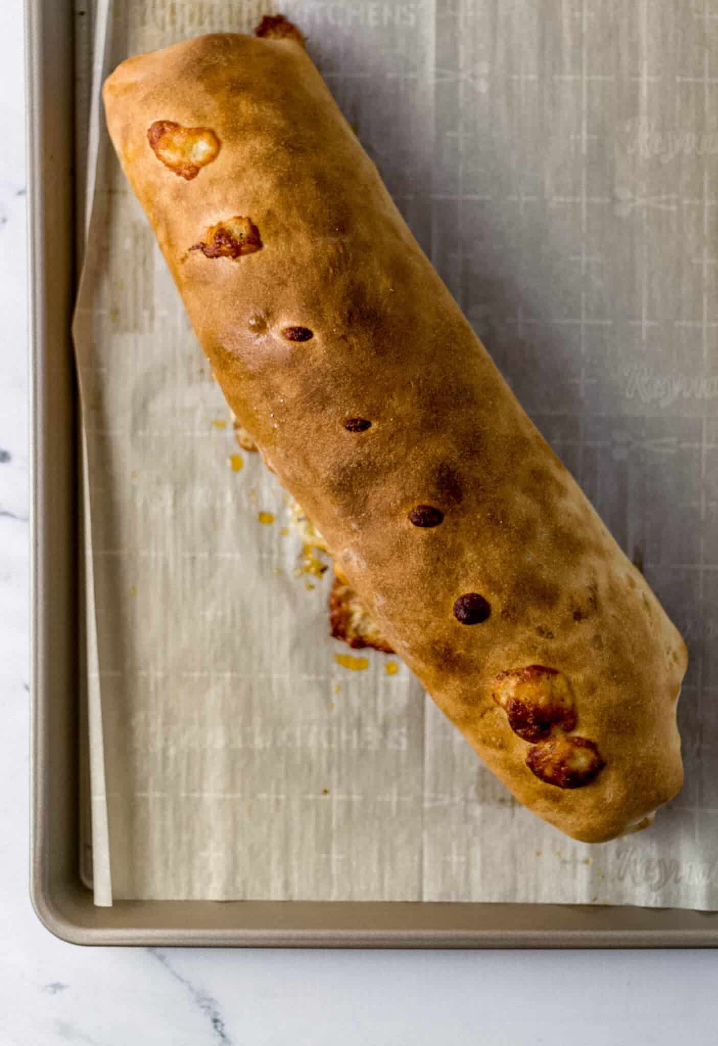 baked bread on parchment lined baking sheet 