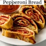 Close up view of bread on white plate with sauce on pin with text overlay.