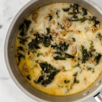 Overhead view of finished soup in a saucepan.