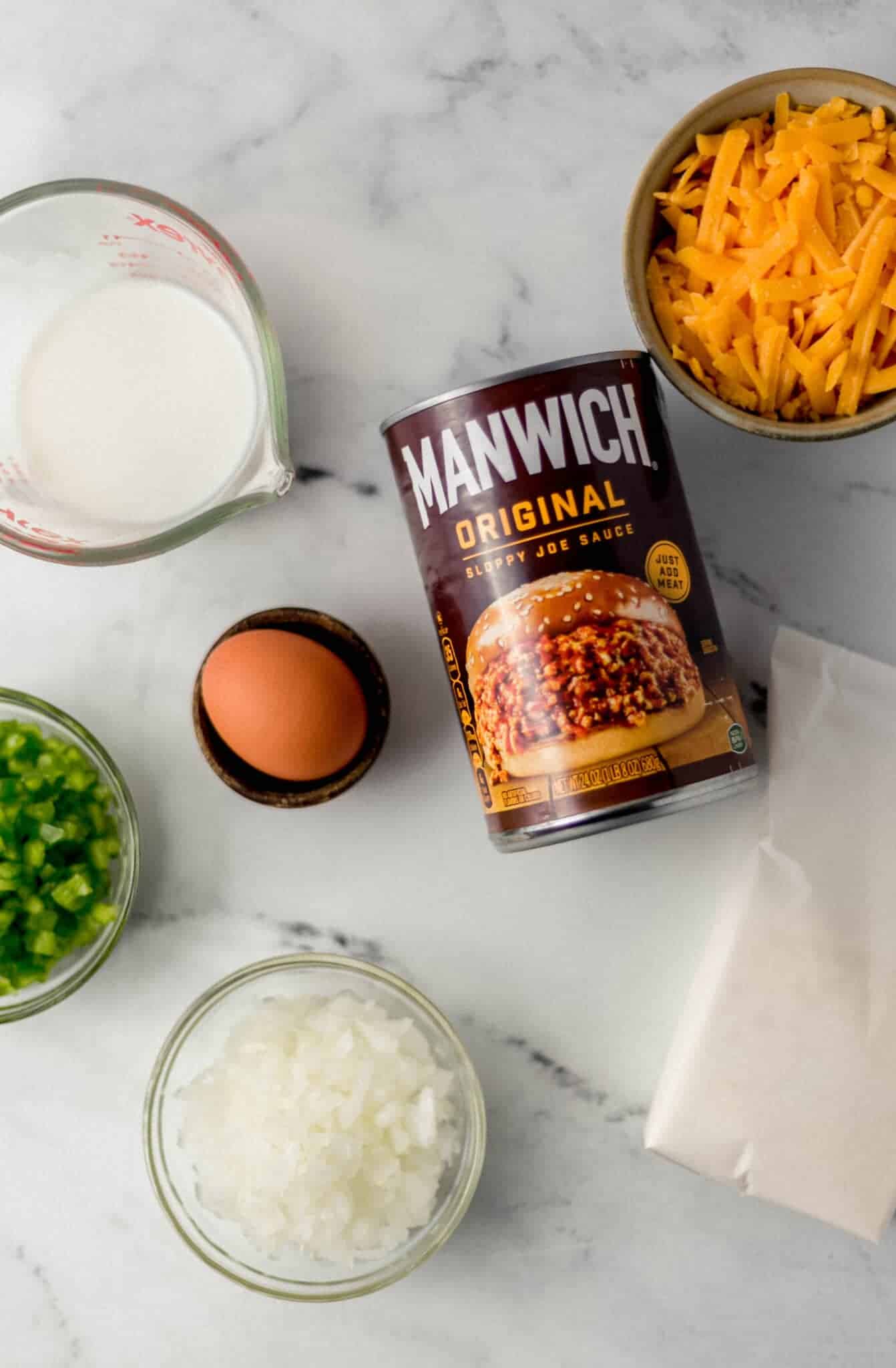 ingredients needed to make casserole in separate bowls and containers