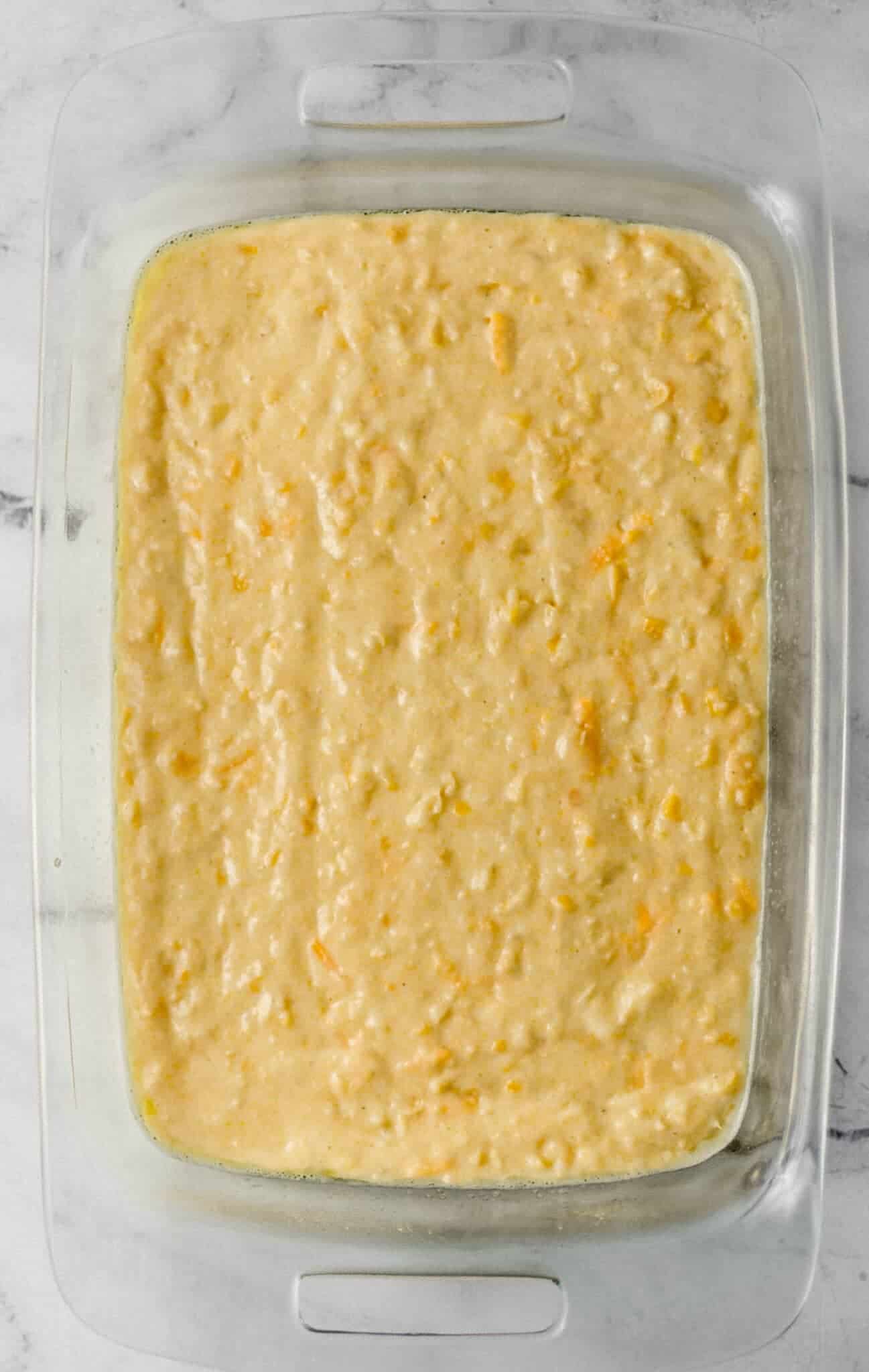 cornbread mixture spread in rectangle baking dish