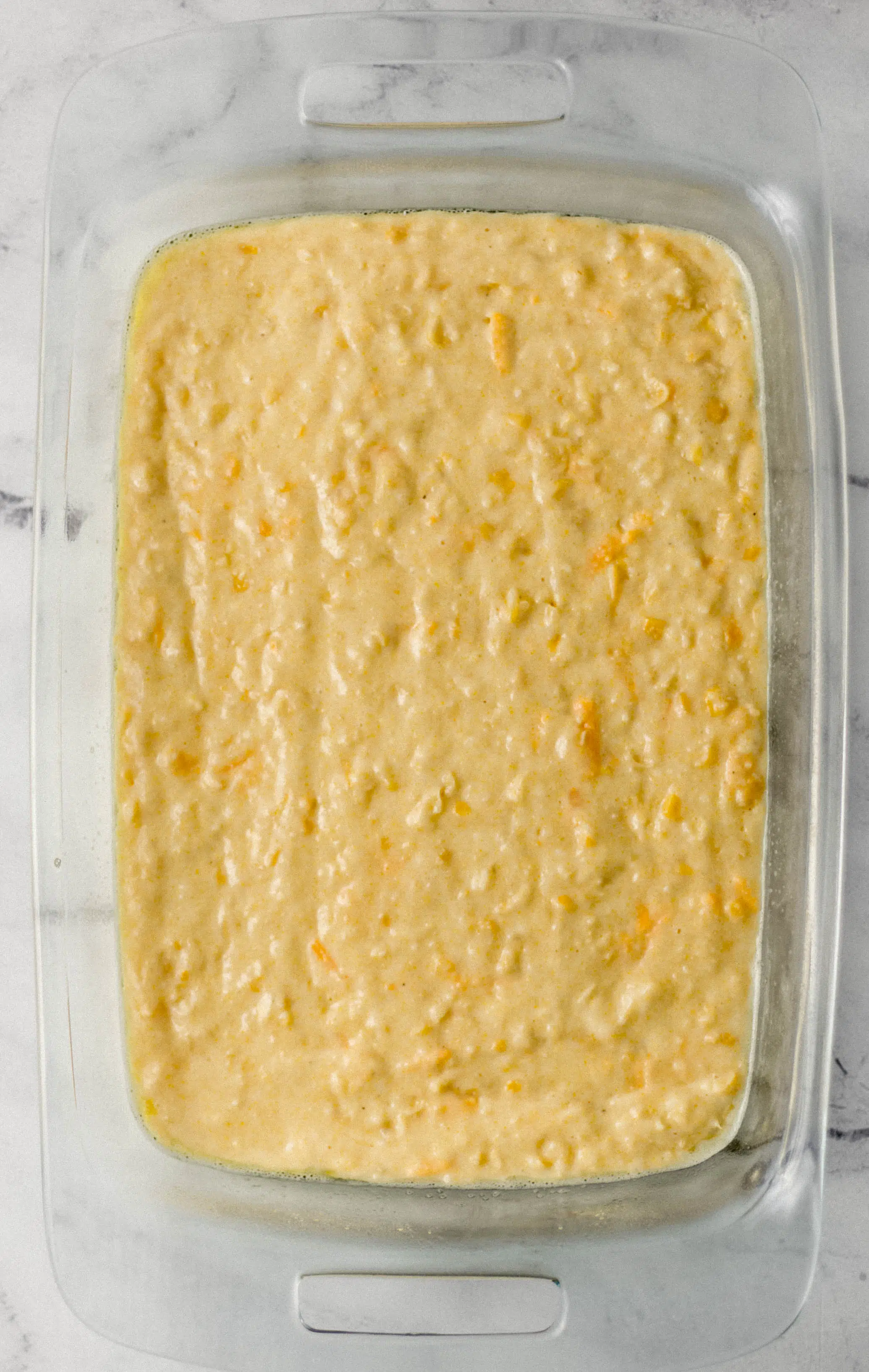 cornbread mixture spread in rectangle baking dish 