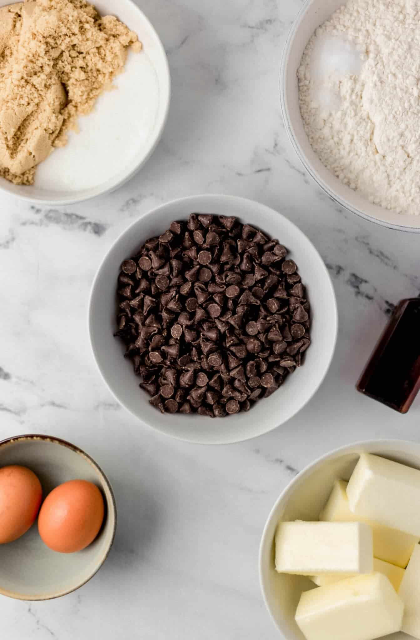 overhead view of ingredients needed for cookie recipe in separate bowls 