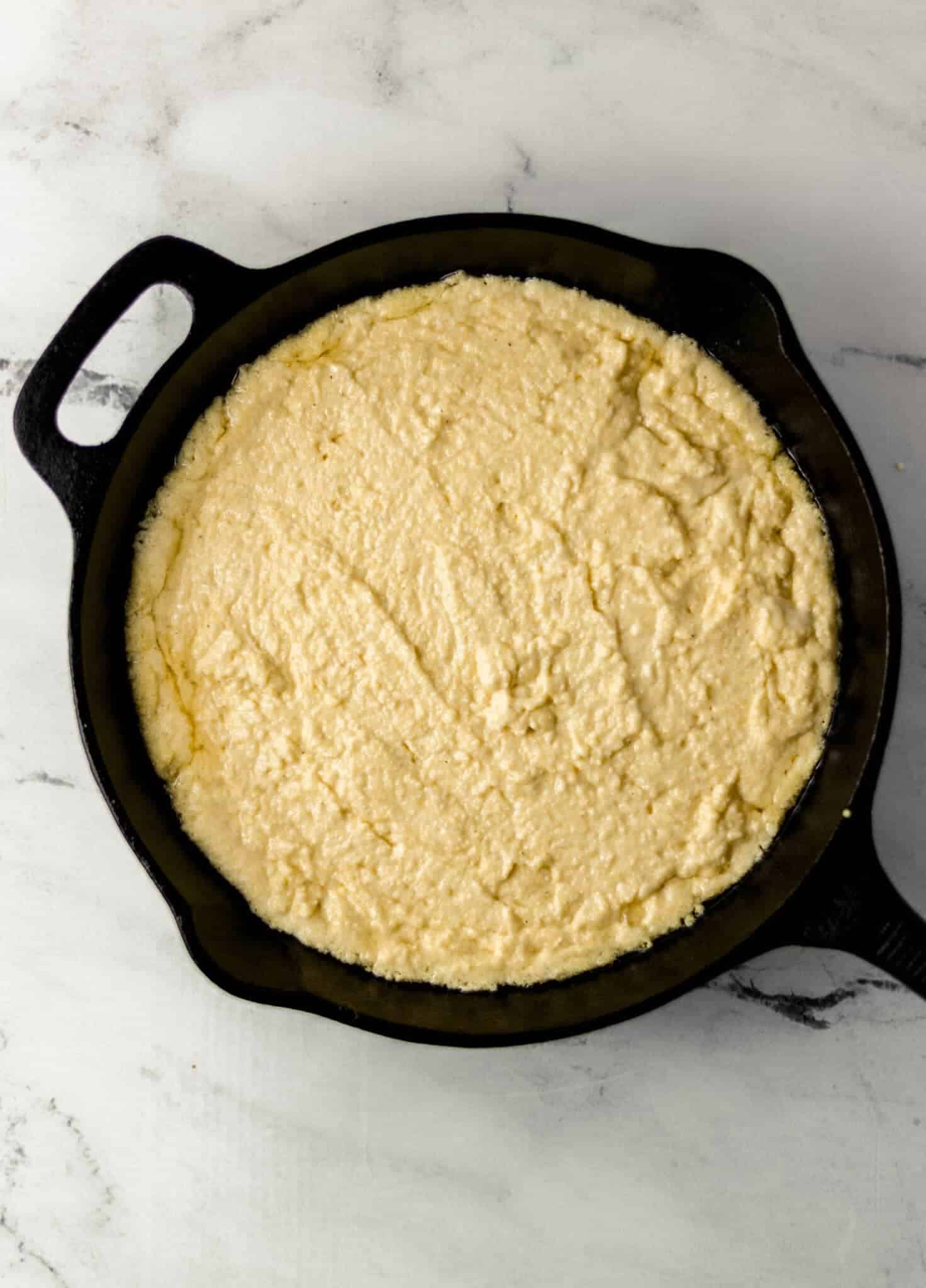 cornbread mixture added to preheat skillet 