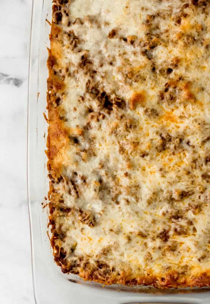 overhead view of finished baked spaghetti recipe in glass baking dish
