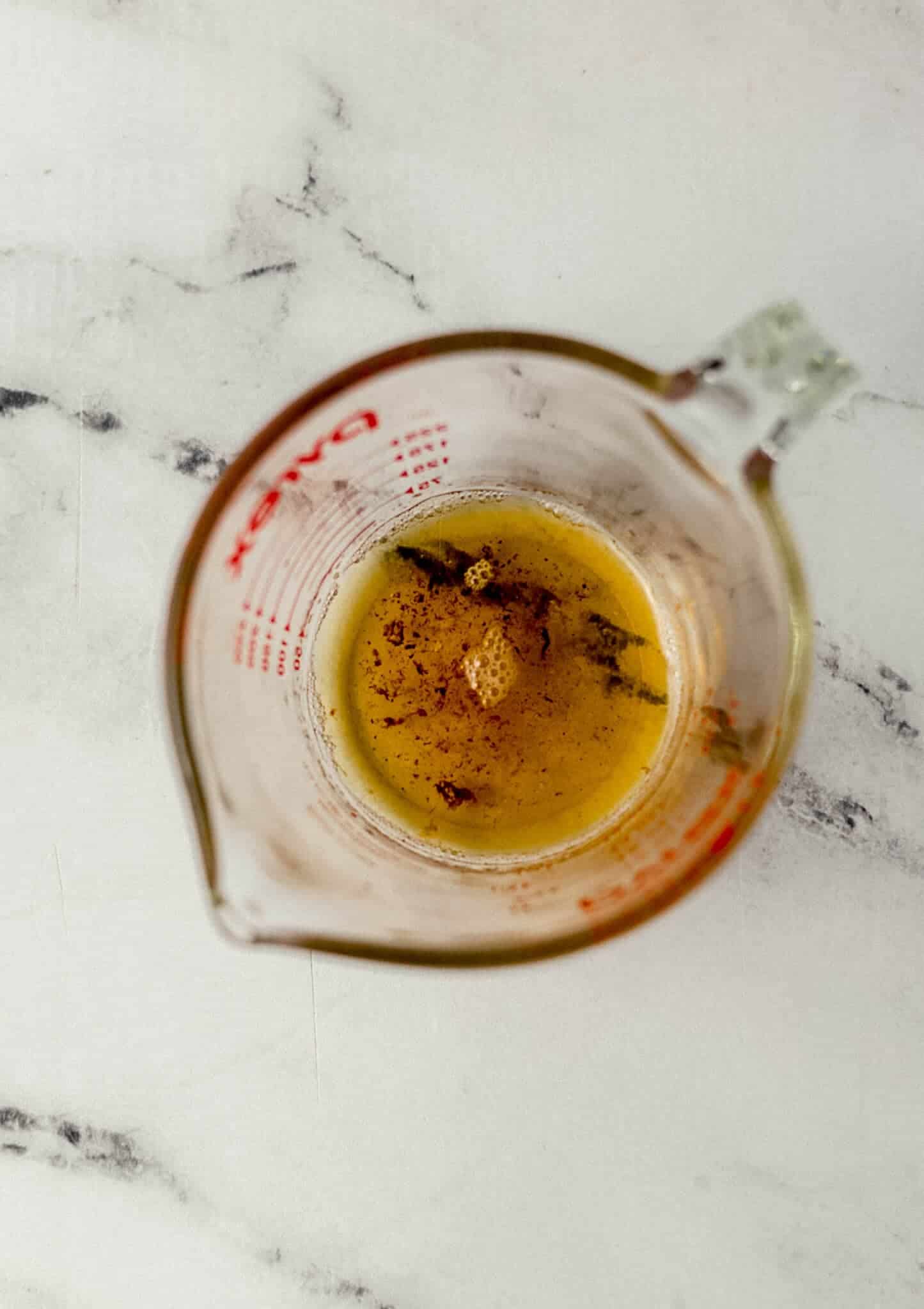 bacon drippings in a glass measuring cup 