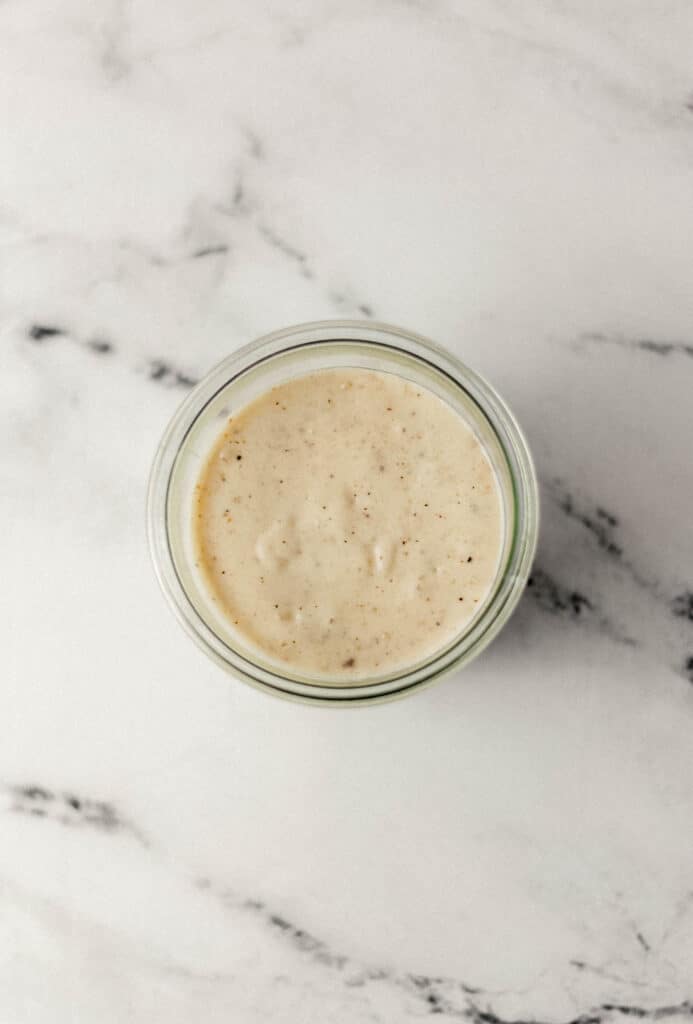 overhead view of finished gravy in glass jar