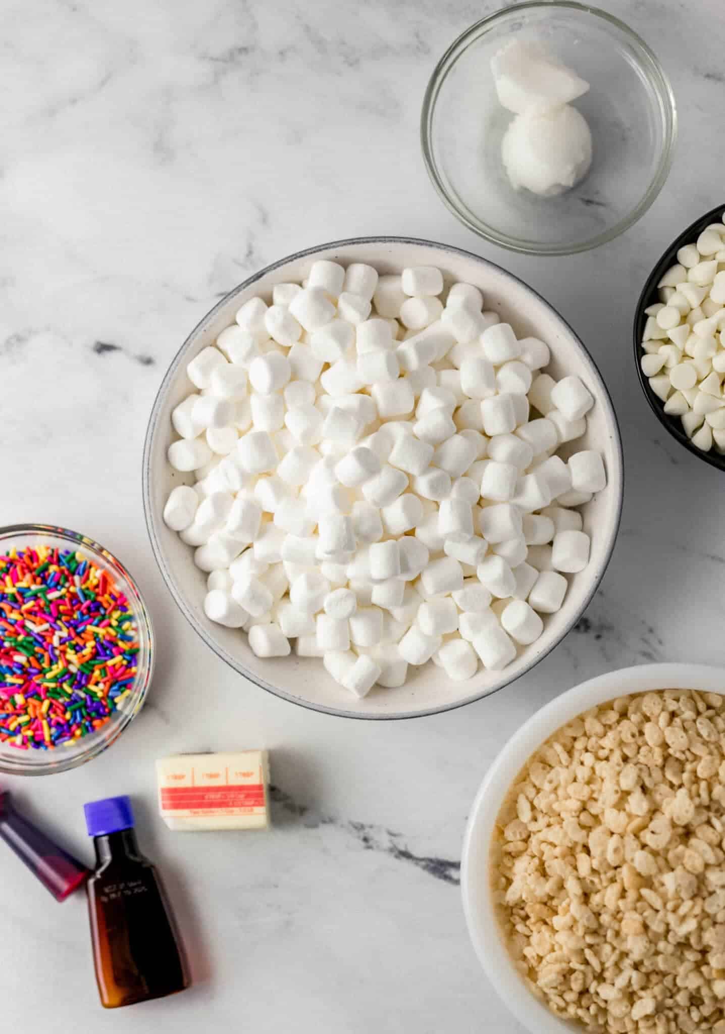 overhead view of ingredients needed to make rice krispie treats in separate bowls