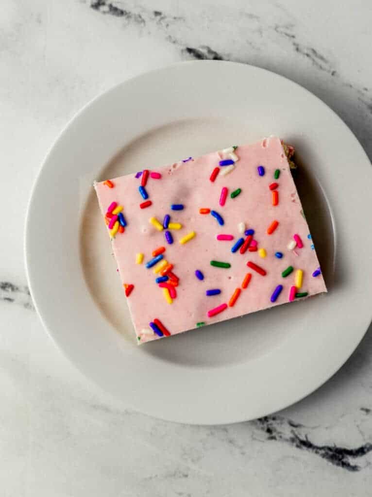 overhead view of funfetti rice krispie treat on white plate