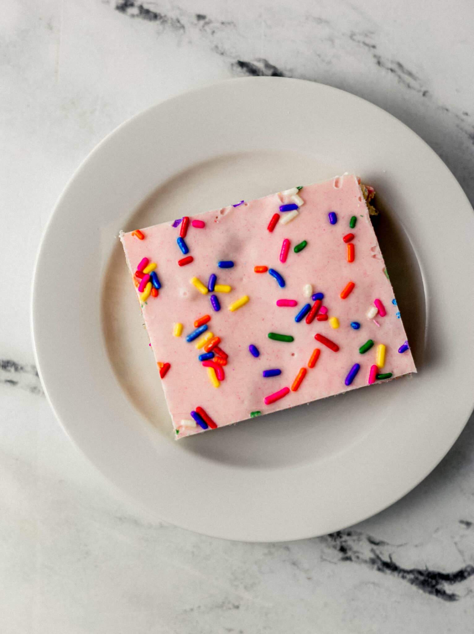 finished single rice krispie treat on small white plate 